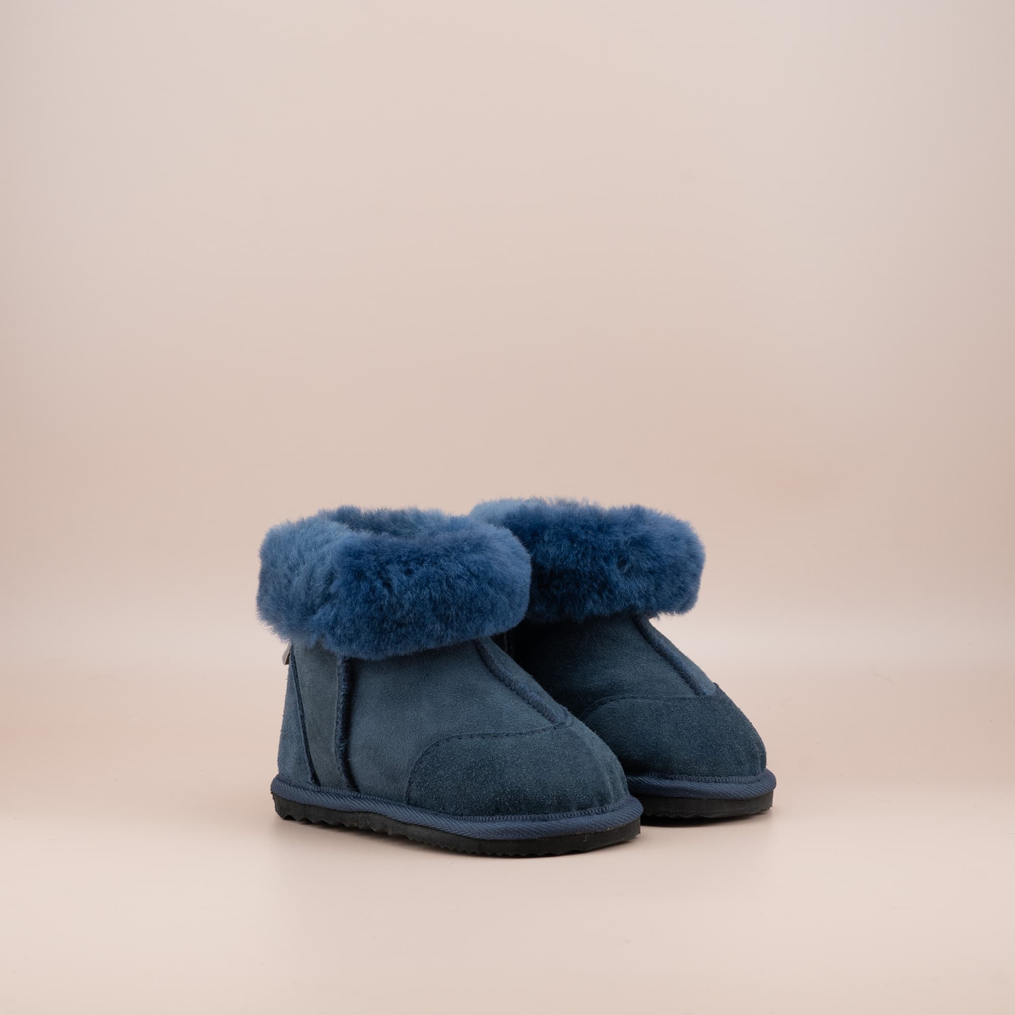 Toddler's ugg boots in soft suede navy with wool turn, front side view. #color_navy