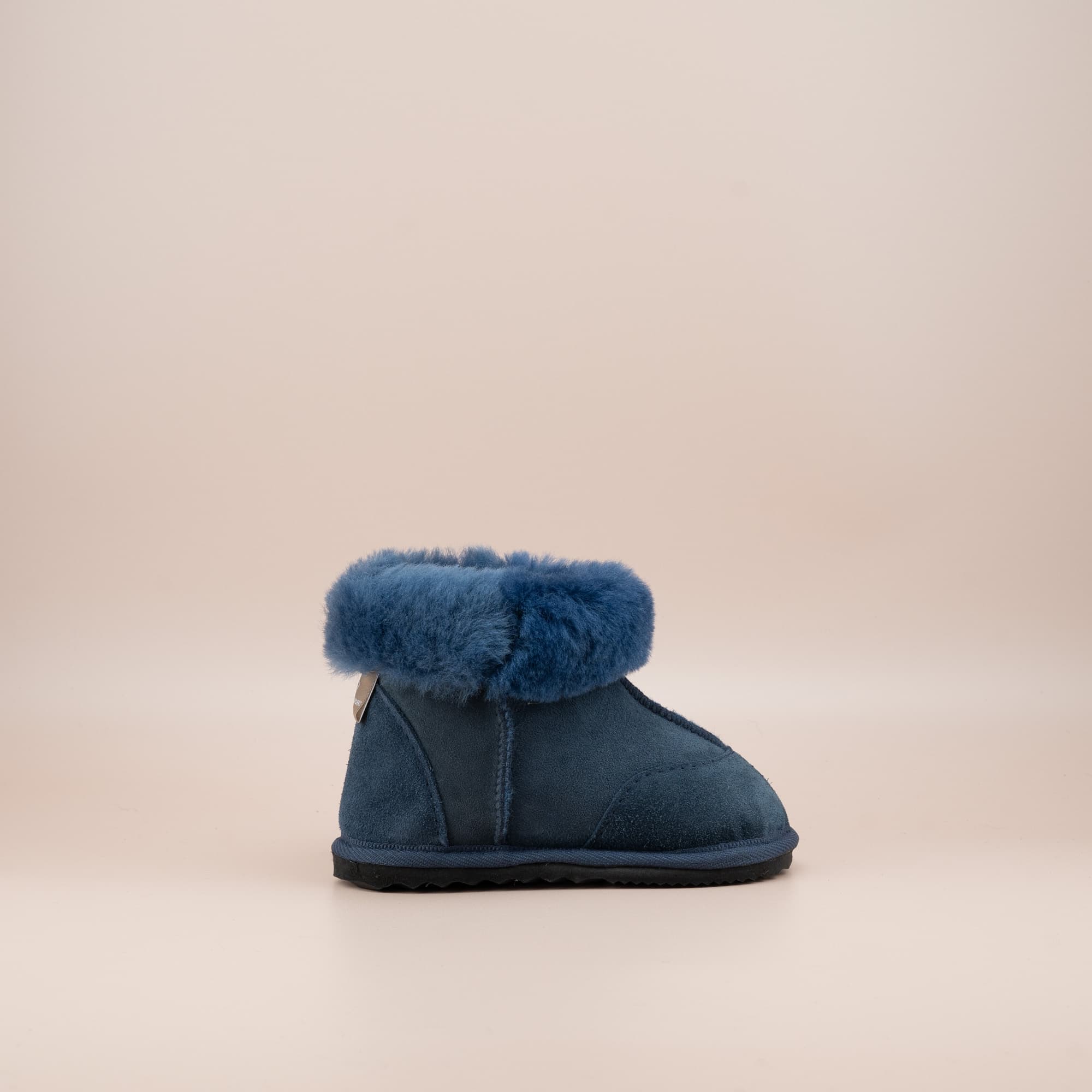 Toddler's ugg boots in soft suede navy with wool turn, side view. #color_navy