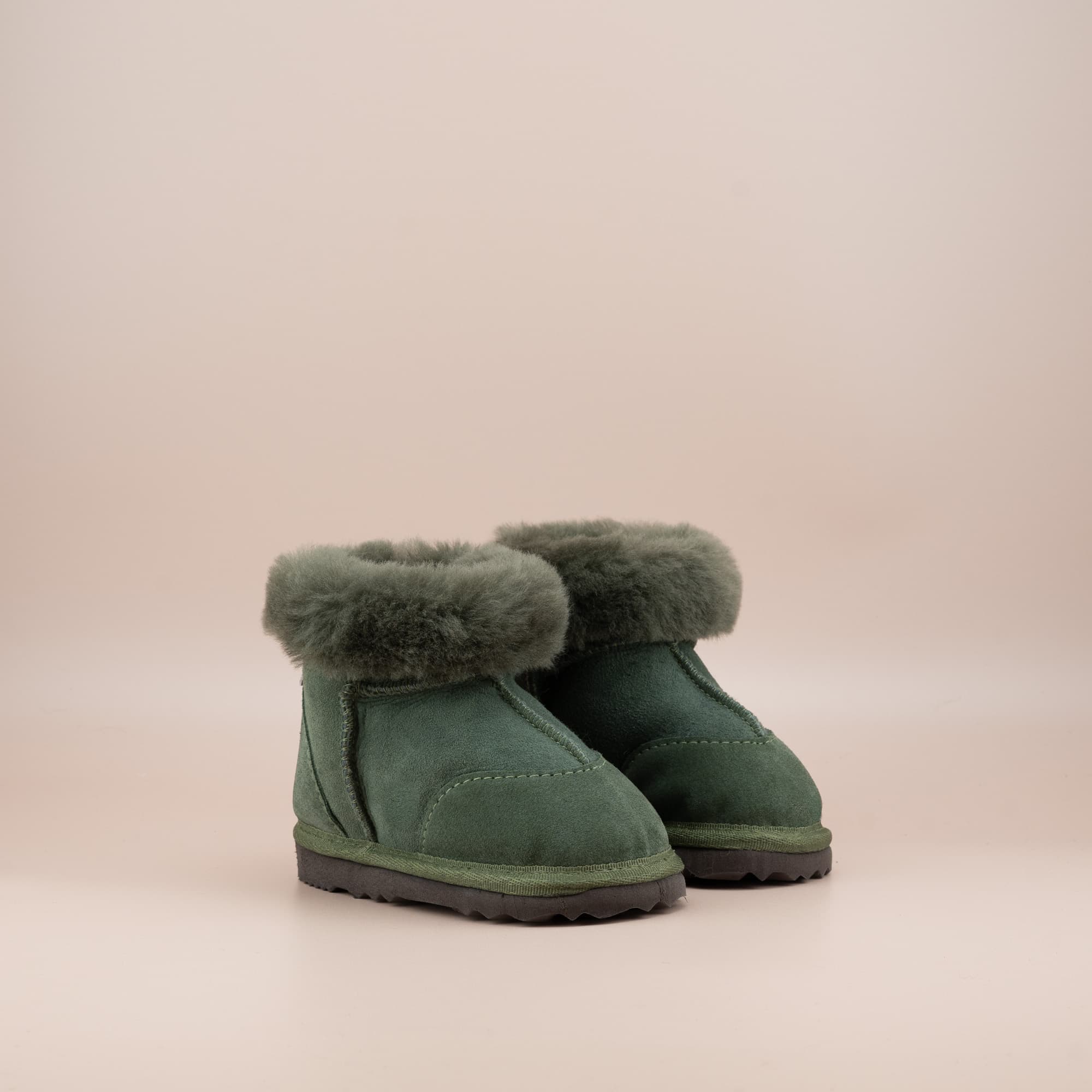 Toddler's ugg boots in soft suede olive with wool turn, front side view. #color_olive