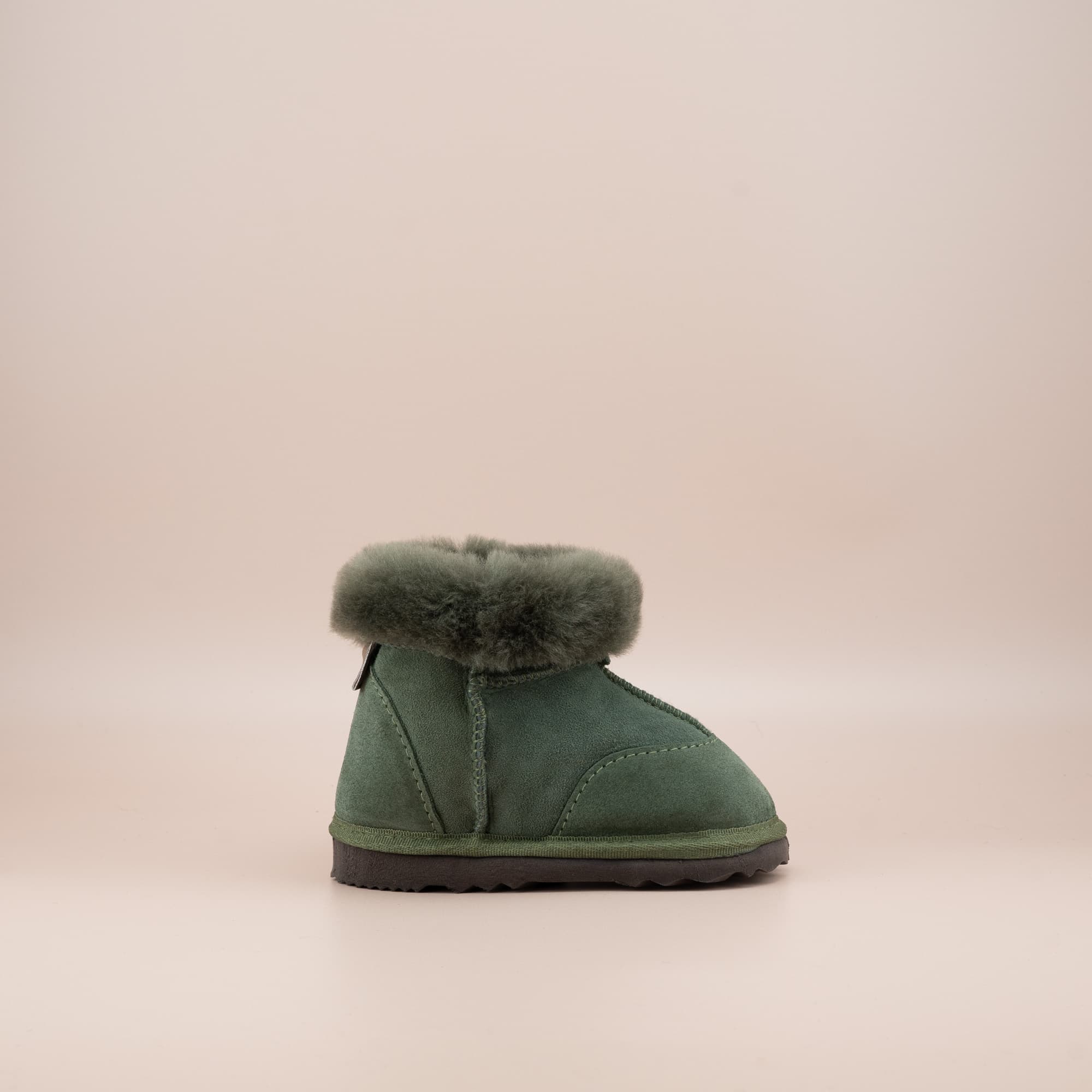 Toddler's ugg boots in soft suede olive with wool turn, side view. #color_olive