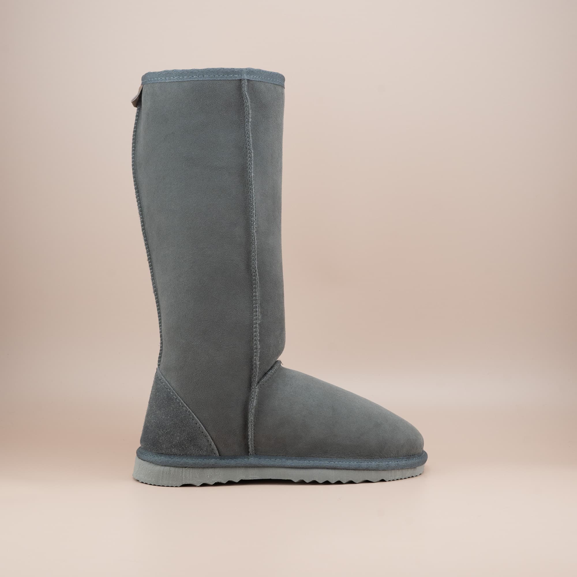 Women's classic short ugg boot in suede grey color, side view. #color_grey