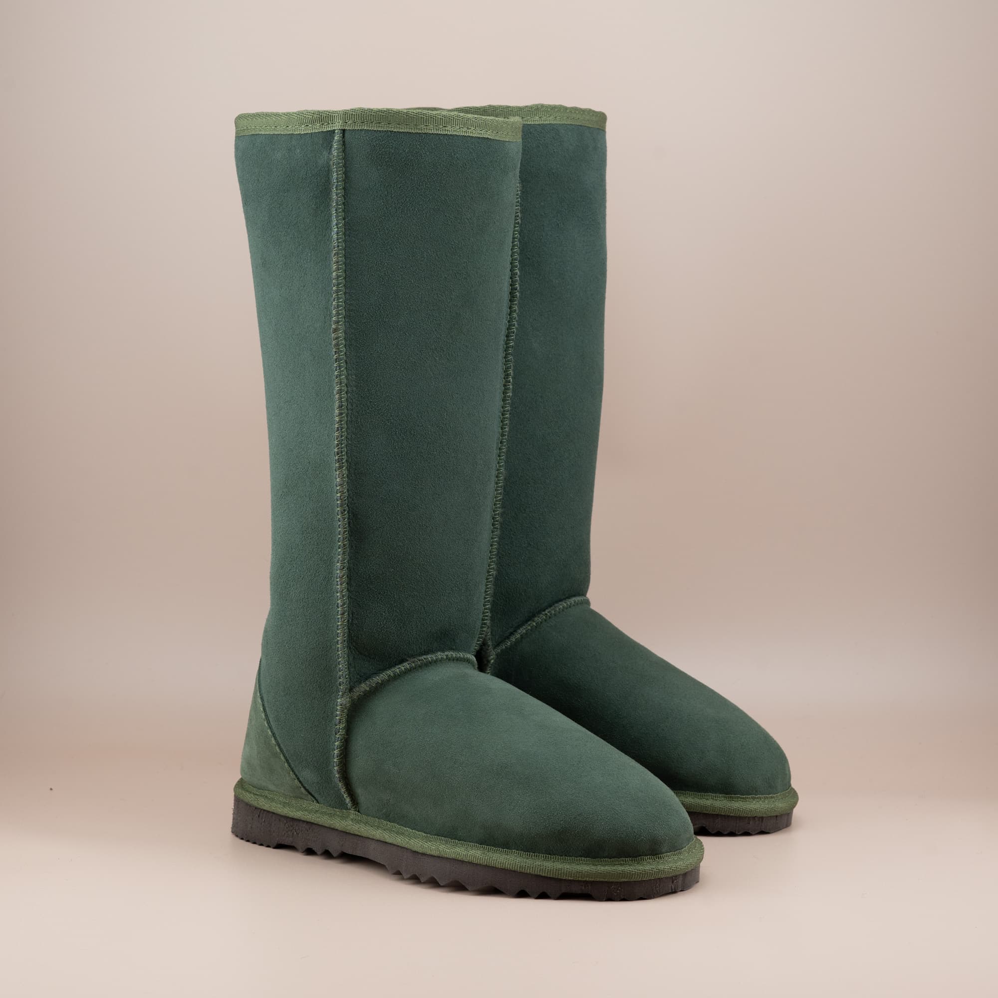 Women's classic long ugg boot in suede olive color, front view. #color_olive