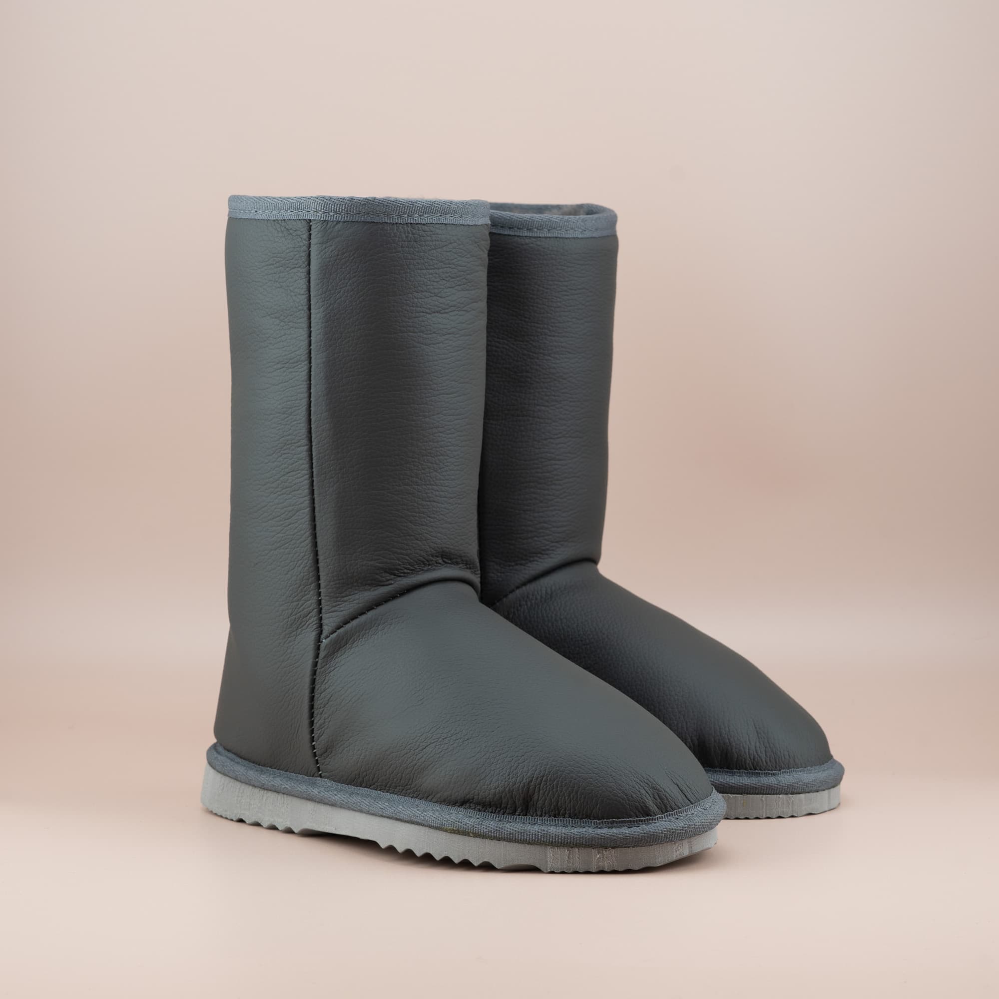 Women's classic mid ugg boots in grey leather, front side view. #color_leather grey