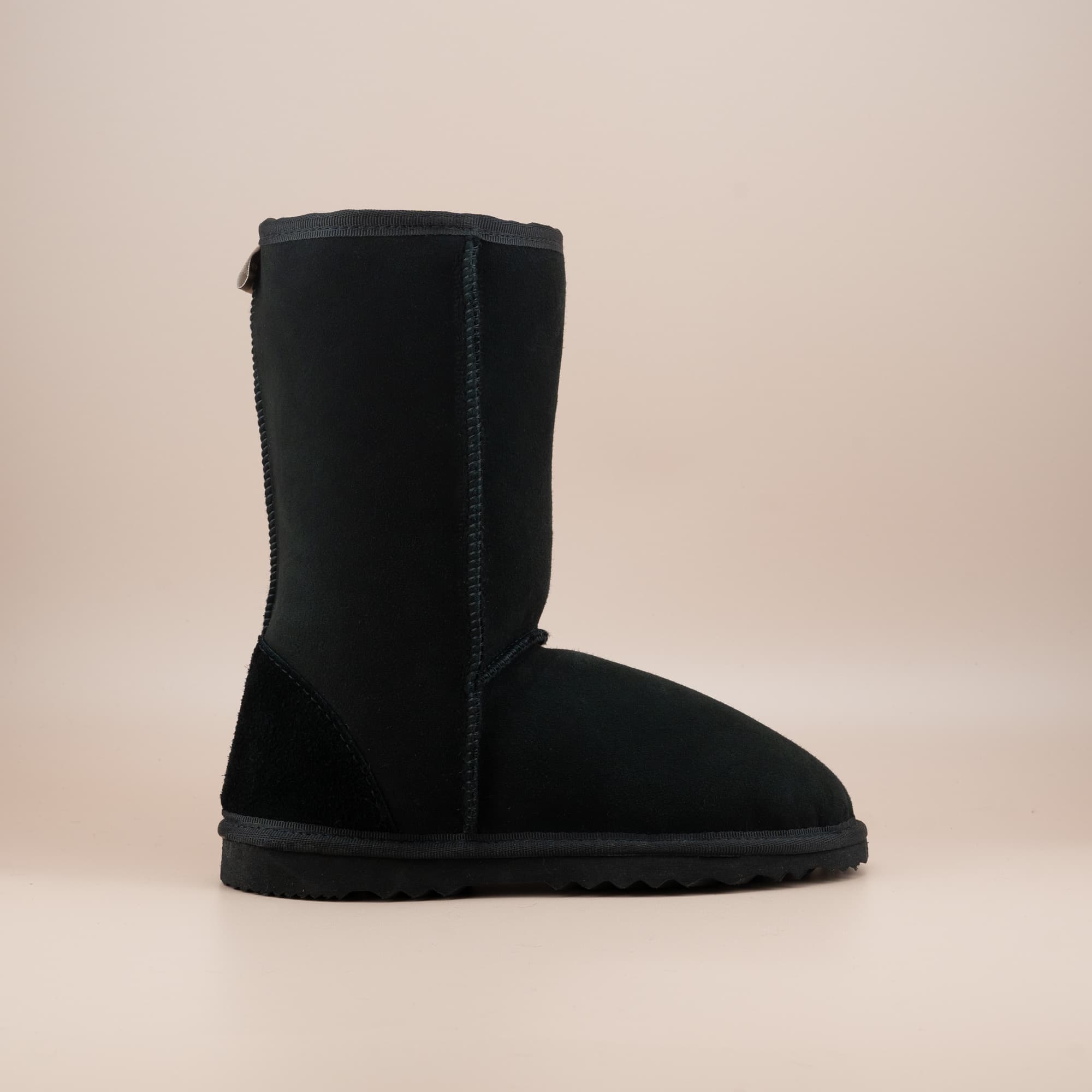 Women's classic mid ugg boot in suede black color, side view. #color_black