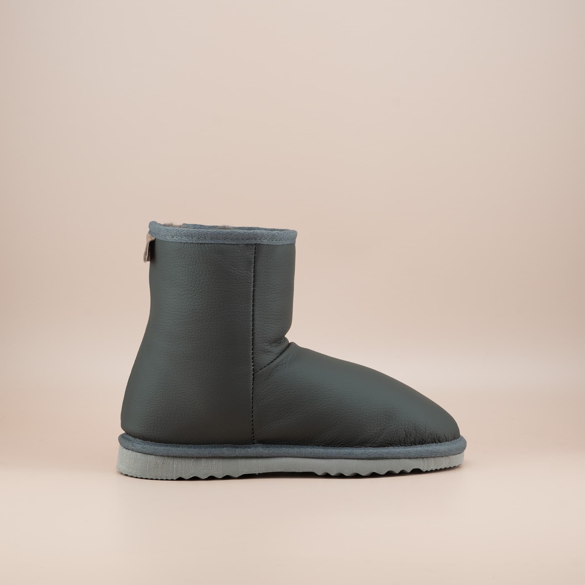 Women's classic short ugg boots in grey leather, side view. #color_leather grey