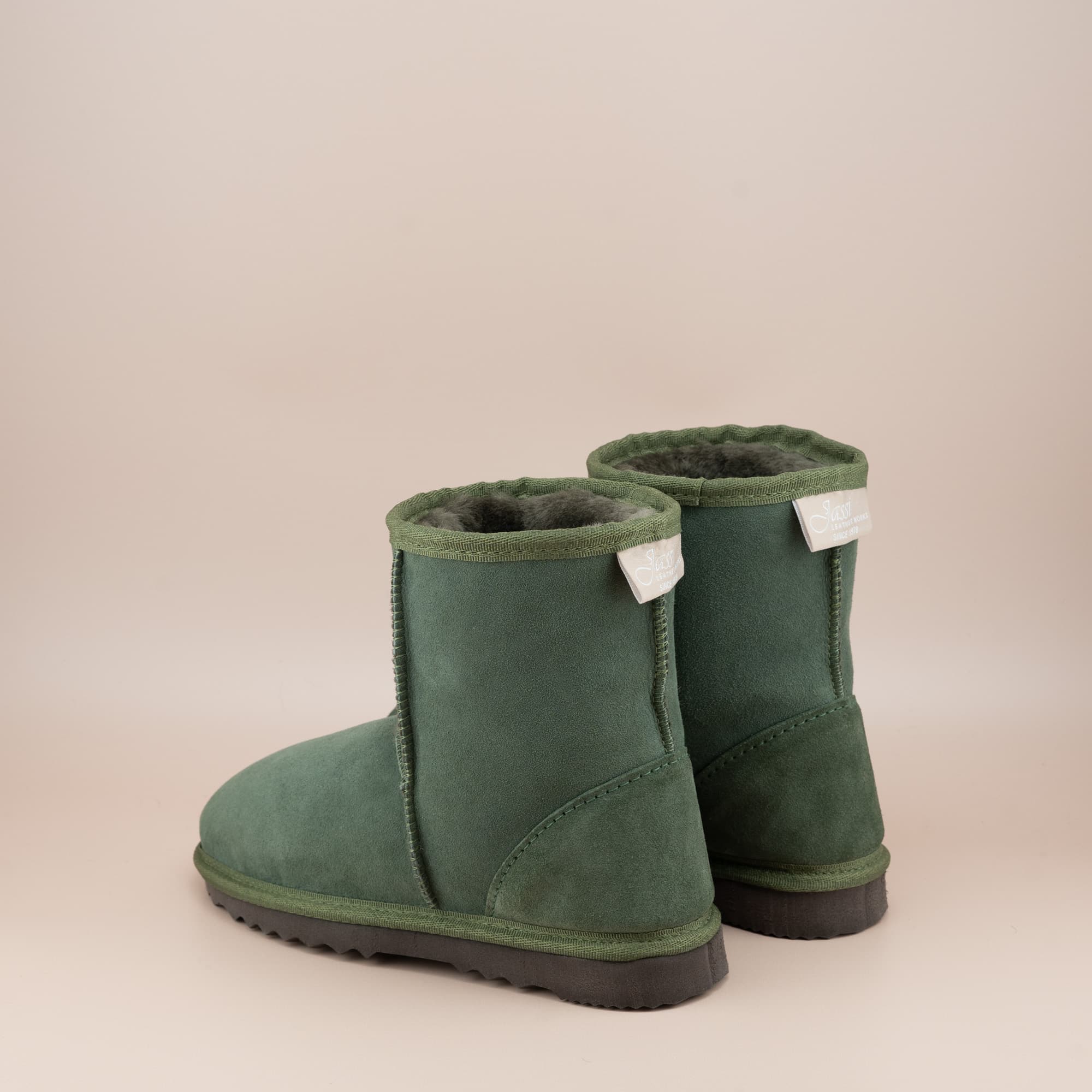 Women's classic short ugg boot in suede olive color, back view. #color_olive