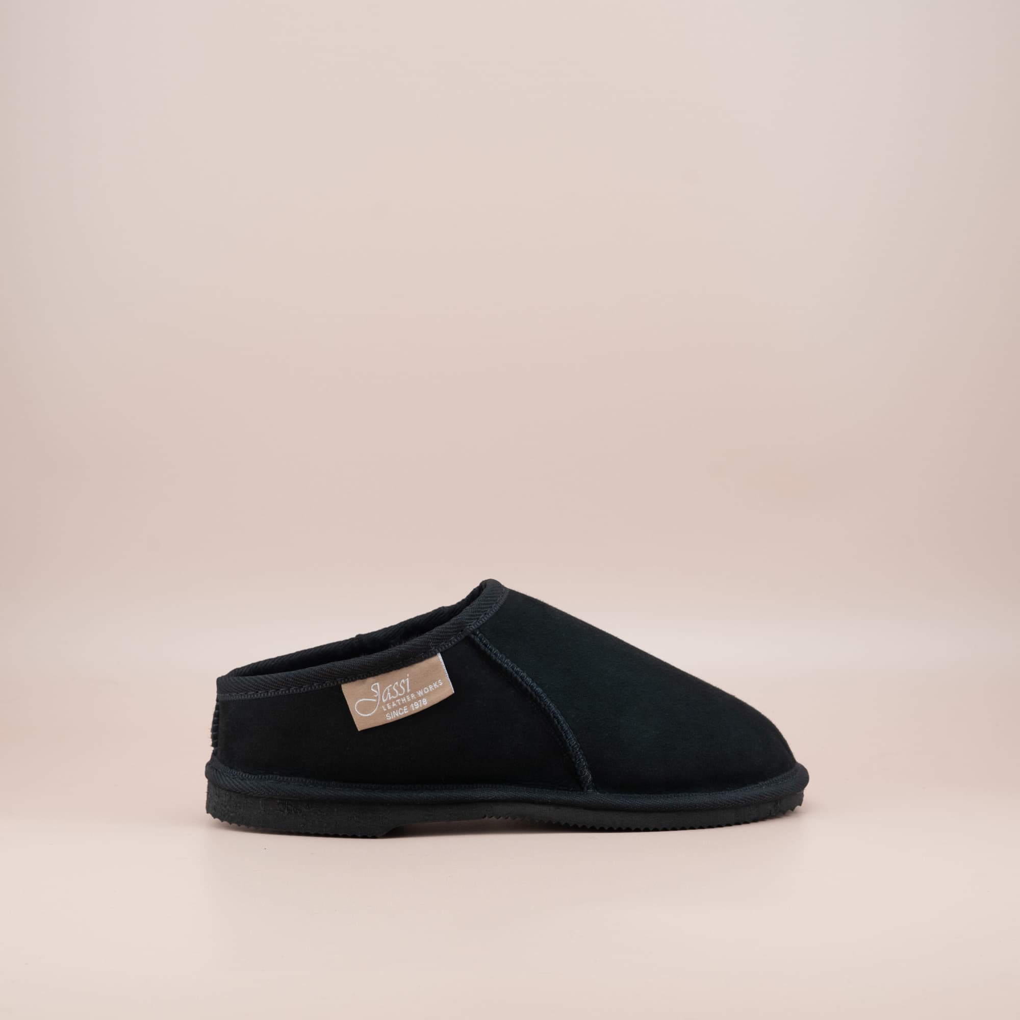 Women's ugg mewels in black suede, single side view. #color_black