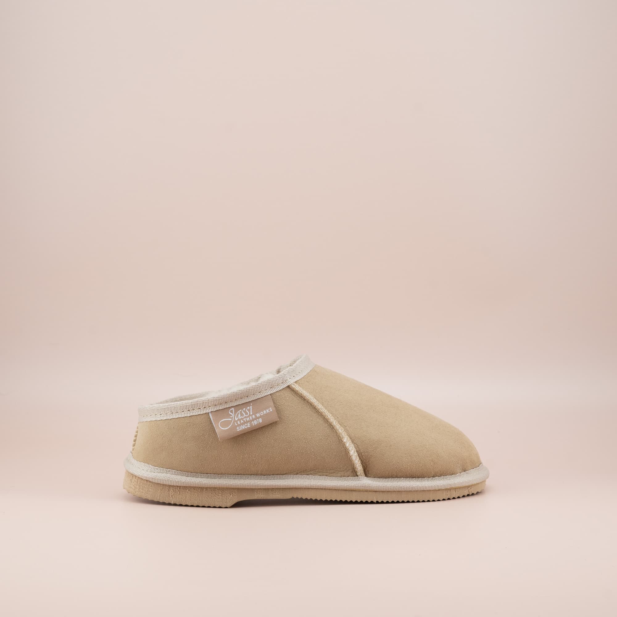 Women's ugg mewels in sand suede, single side view. #color_sand