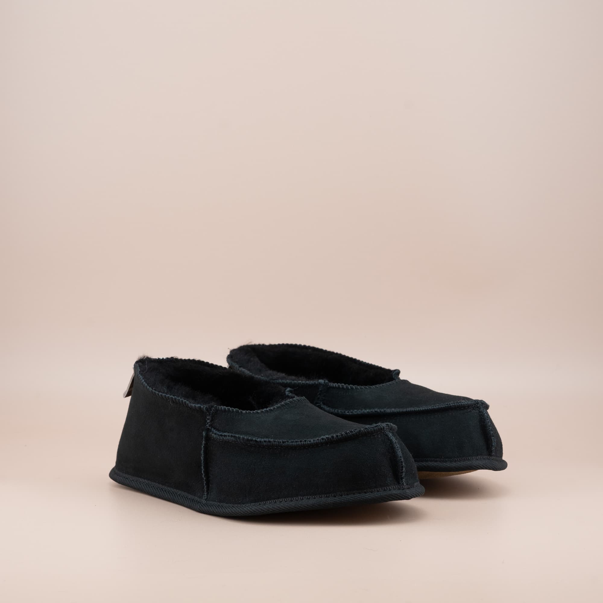 Women's ugg moccasins in black suede, side view of the pair. #color_black