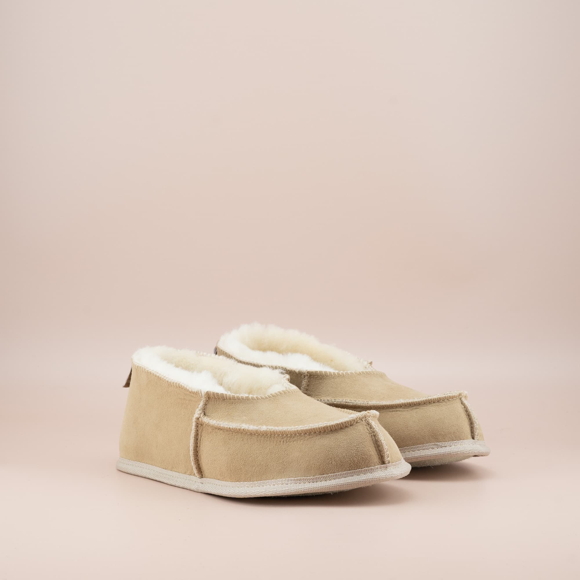 Women's ugg moccasins in sand suede, side view of the pair. #color_sand