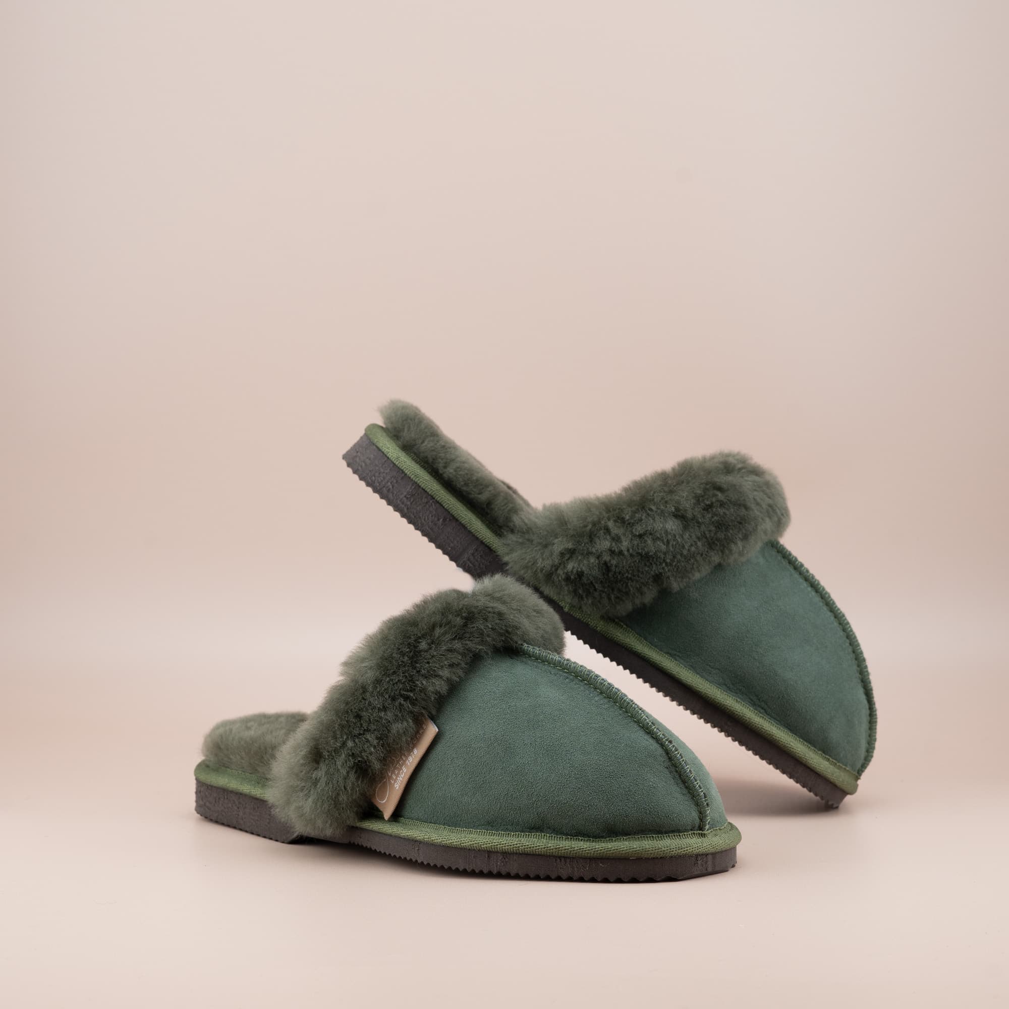 Women's ugg scuffs in olive suede and soft merino wool turn, front and side view of the pair. #color_olive