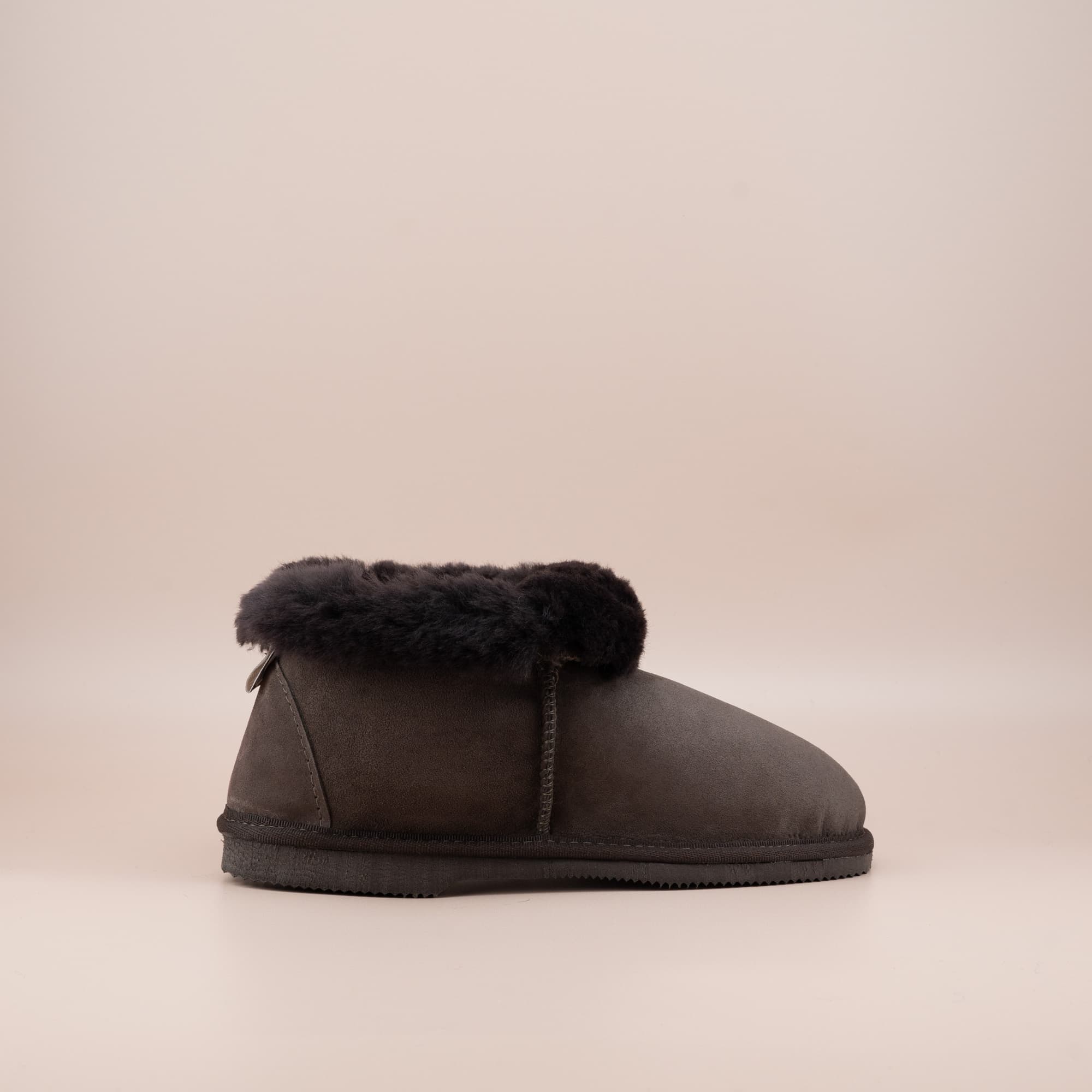 Women's ugg slippers in chocolate suede and wool turn, single side view. #color_chocolate