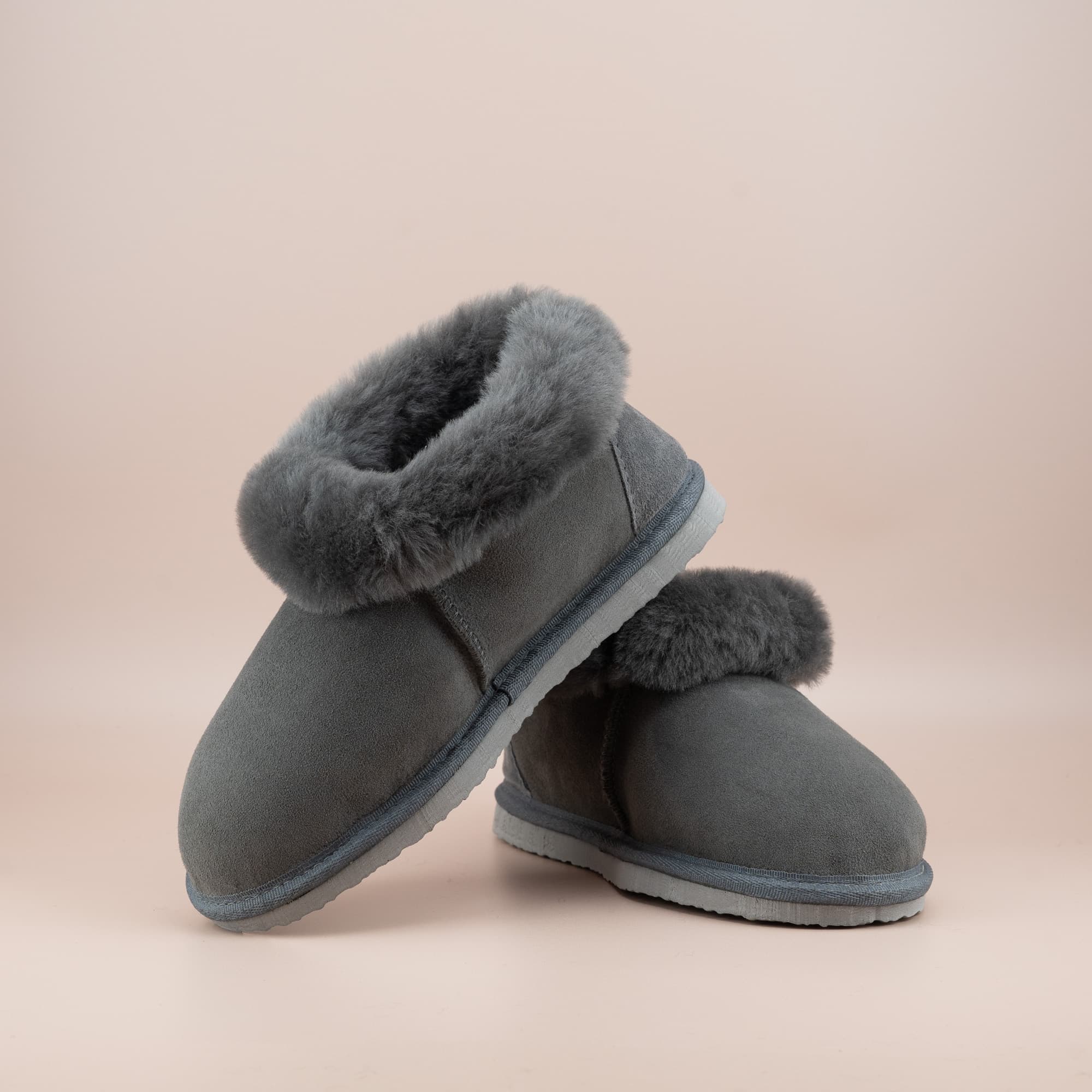 Women's ugg slippers in grey suede and wool turn, front and side view of the pair. #color_grey