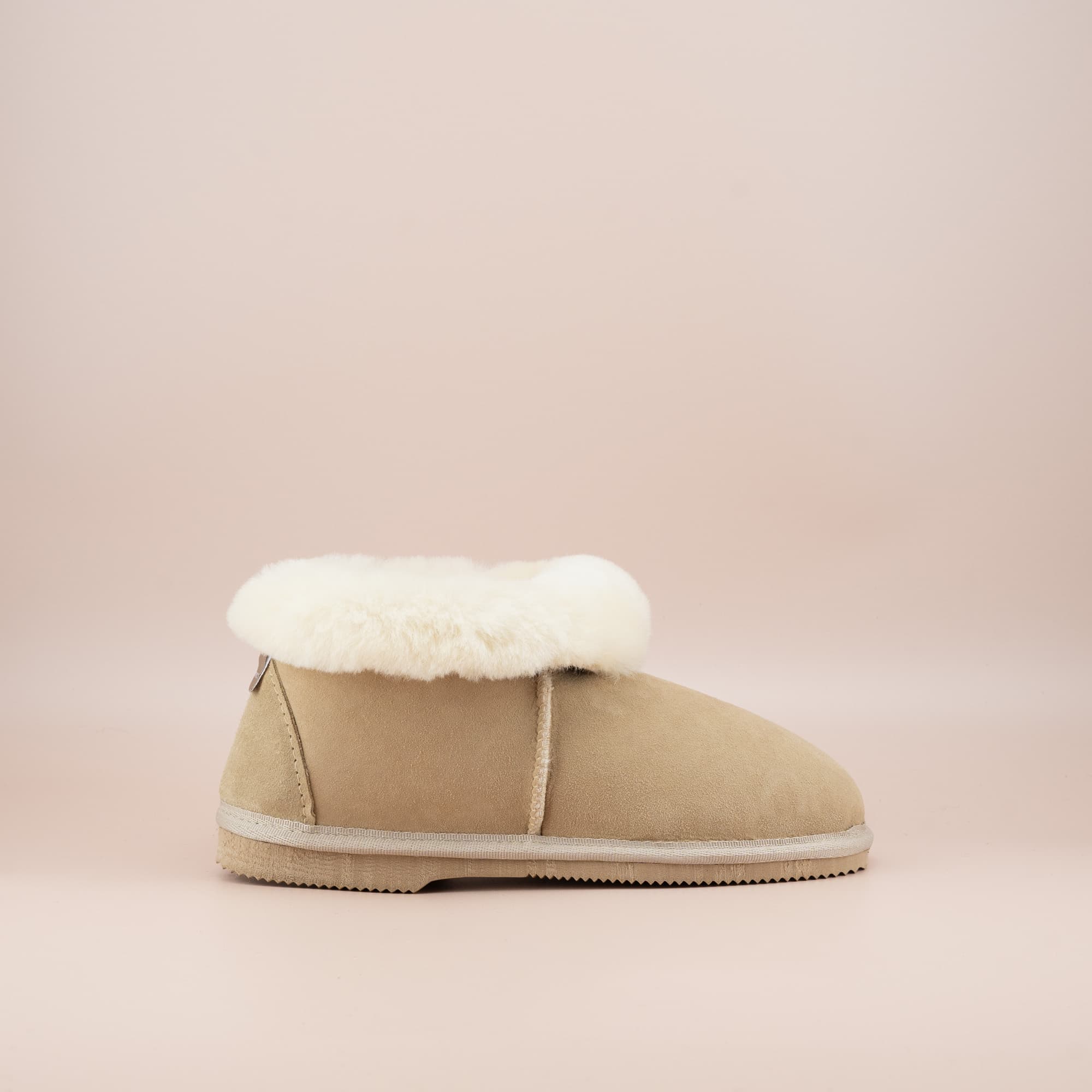 Women's ugg slippers in sand suede and wool turn, single side view. #color_sand